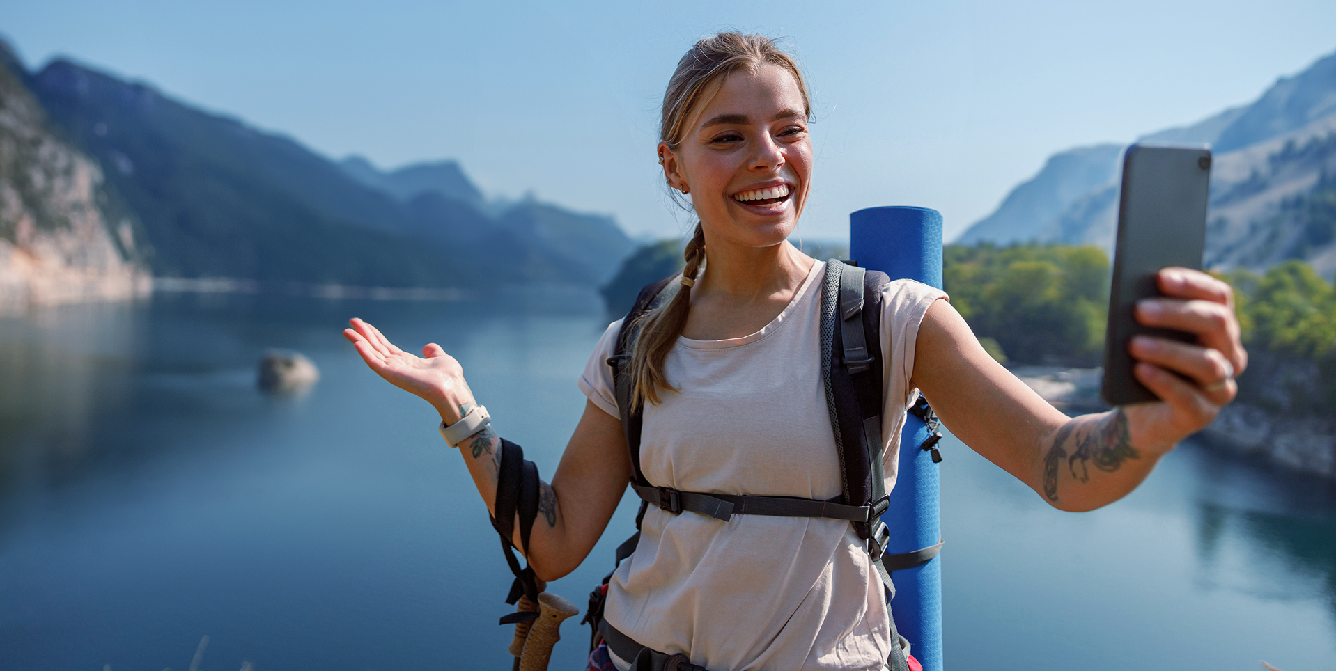 Traveler using smartphone with scenic background